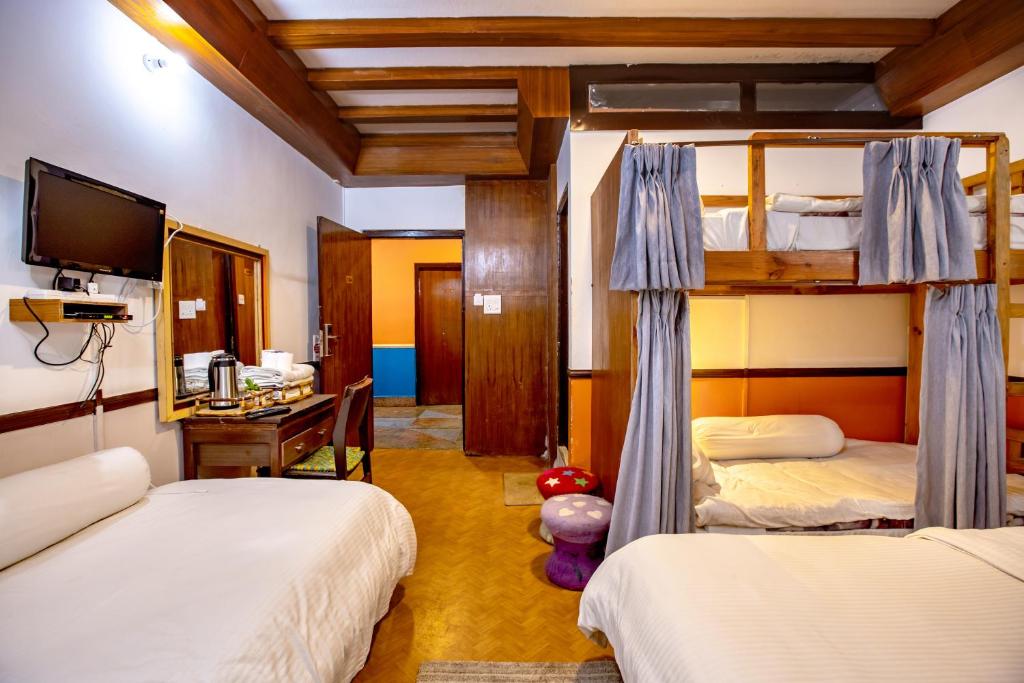 Postel nebo postele na pokoji v ubytování Shangrila Boutique Hotel