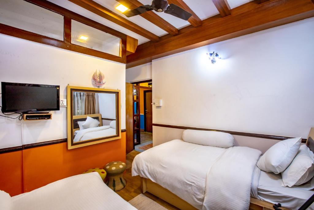 TV a/nebo společenská místnost v ubytování Shangrila Boutique Hotel