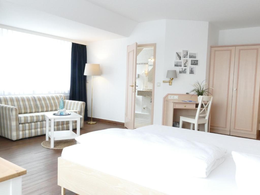 Postel nebo postele na pokoji v ubytování Hotel Friesenhof