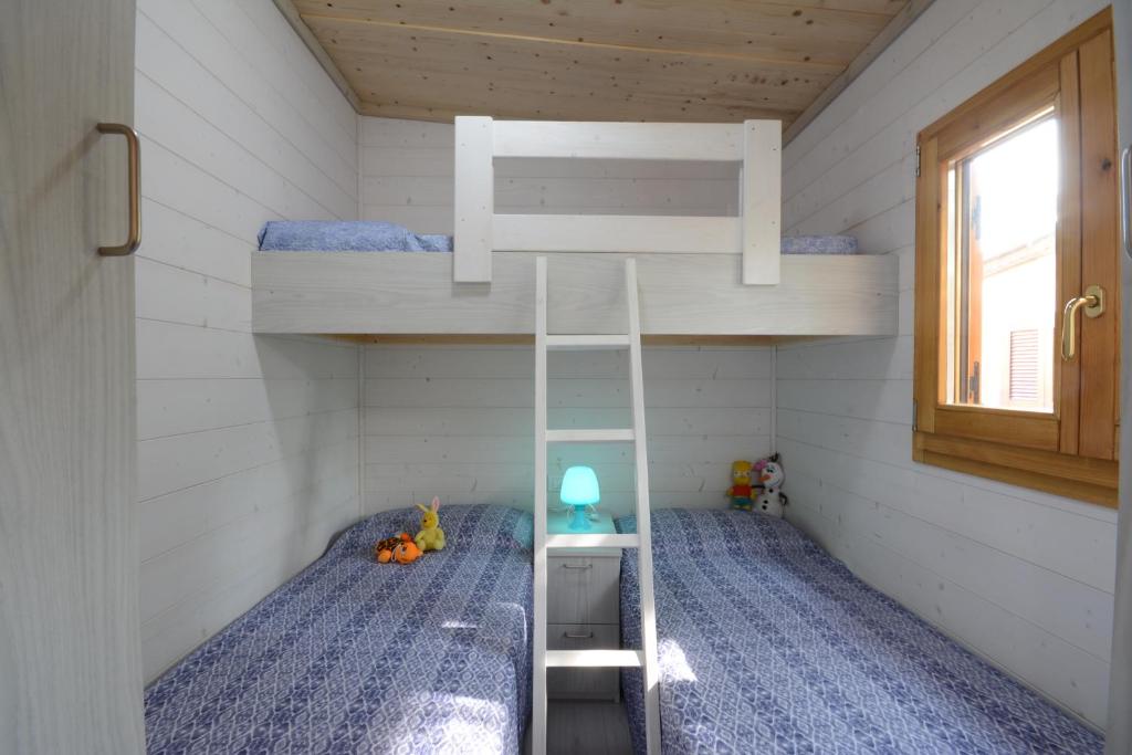 Postel nebo postele na pokoji v ubytování Camping Fano