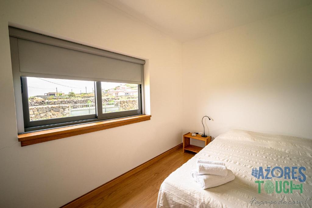 Postel nebo postele na pokoji v ubytování Casa da Barra