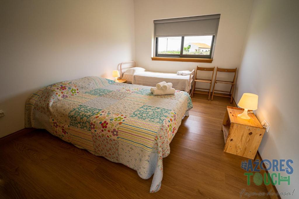 Postel nebo postele na pokoji v ubytování Casa da Barra