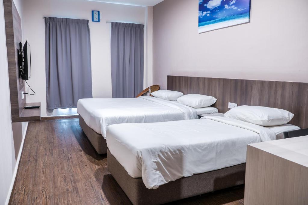 Postel nebo postele na pokoji v ubytování K West Hotel
