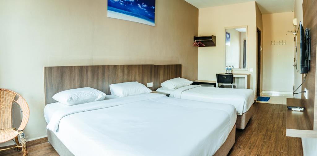 Postel nebo postele na pokoji v ubytování K West Hotel