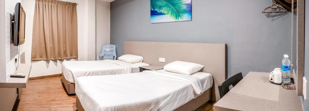 Postel nebo postele na pokoji v ubytování K West Hotel