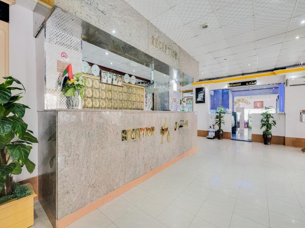 a lobby of a hospital with a reception counter at Al Rayan Hotel in Ajman 