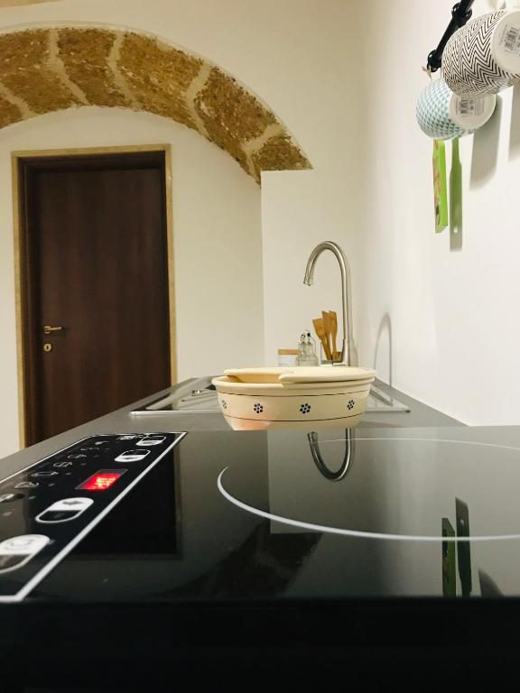 Kuchyň nebo kuchyňský kout v ubytování Co Mó - Camera a Sud - Affittacamere