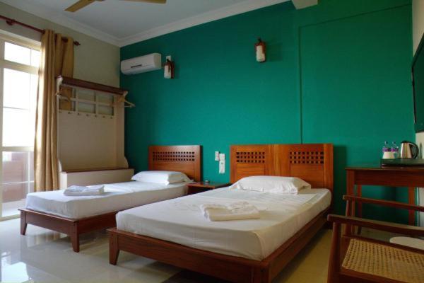 Кровать или кровати в номере Lafala Hotel & Service Apartment