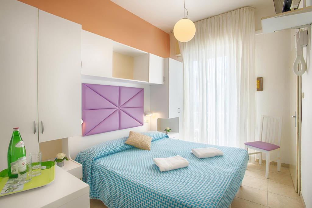 Postel nebo postele na pokoji v ubytování Hotel Meritime