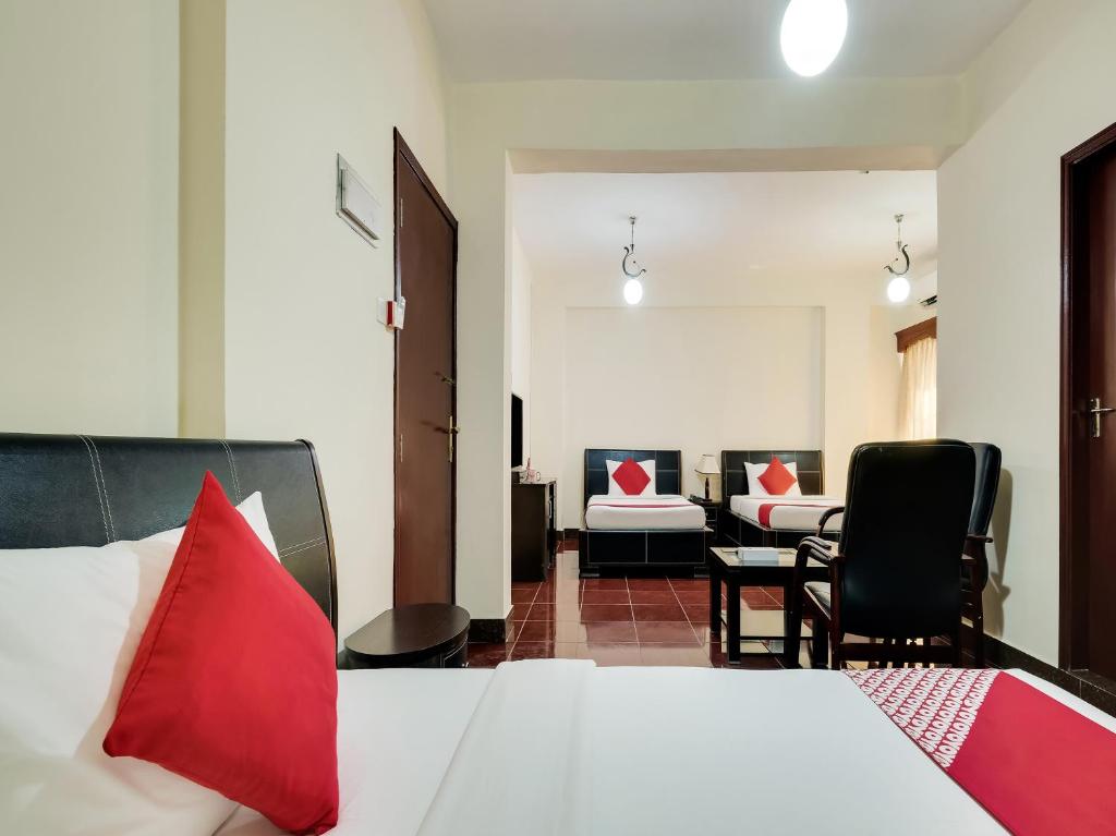 a hotel room with a bed and a living room at Al Rayan Hotel in Ajman 