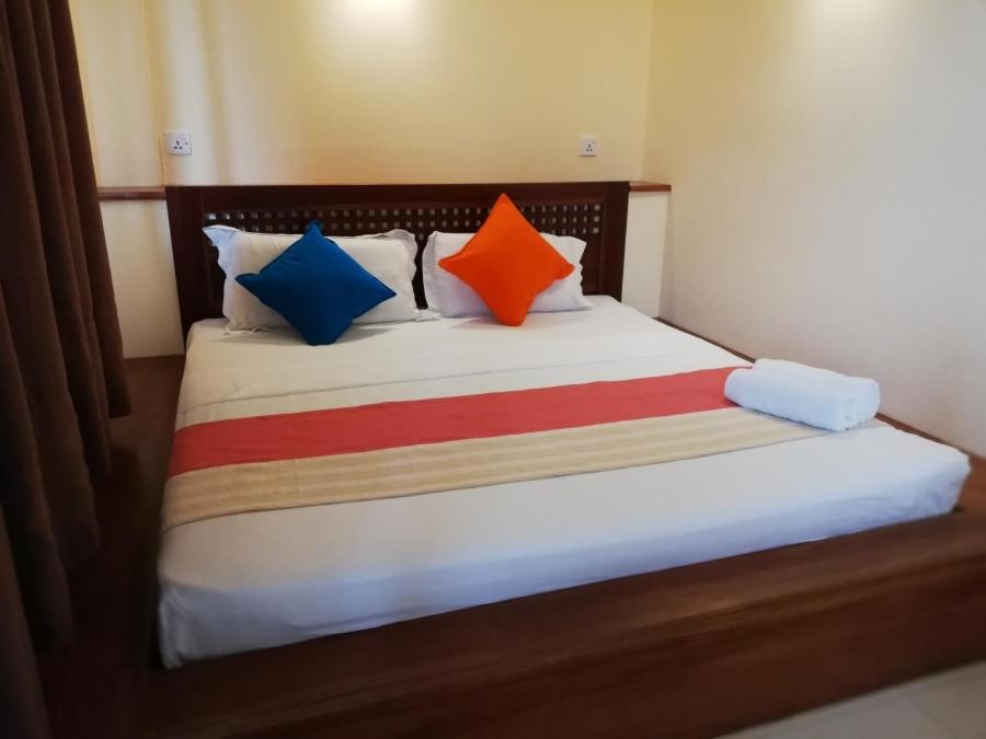 Postel nebo postele na pokoji v ubytování Lafala Hotel & Service Apartment