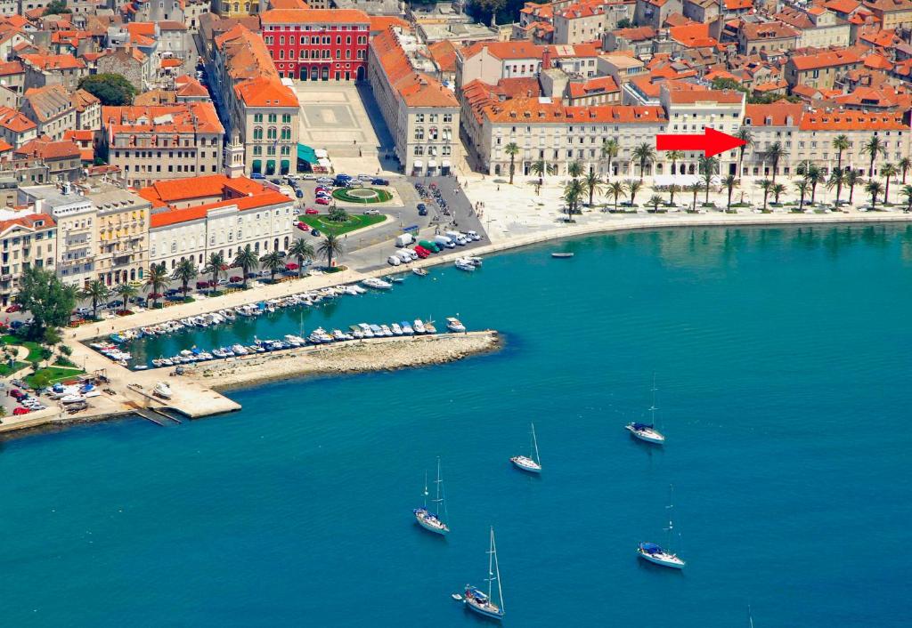 an aerial view of a city with boats in the water at Luxury Apartment Riva with a magnificient view in Split