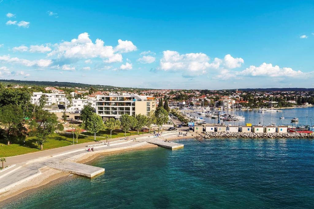 an aerial view of a city and a body of water at Luxury Hotel Riva in Malinska