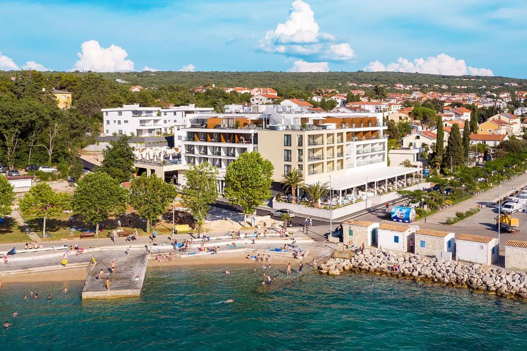 an aerial view of a beach in a city at Luxury Hotel Riva in Malinska