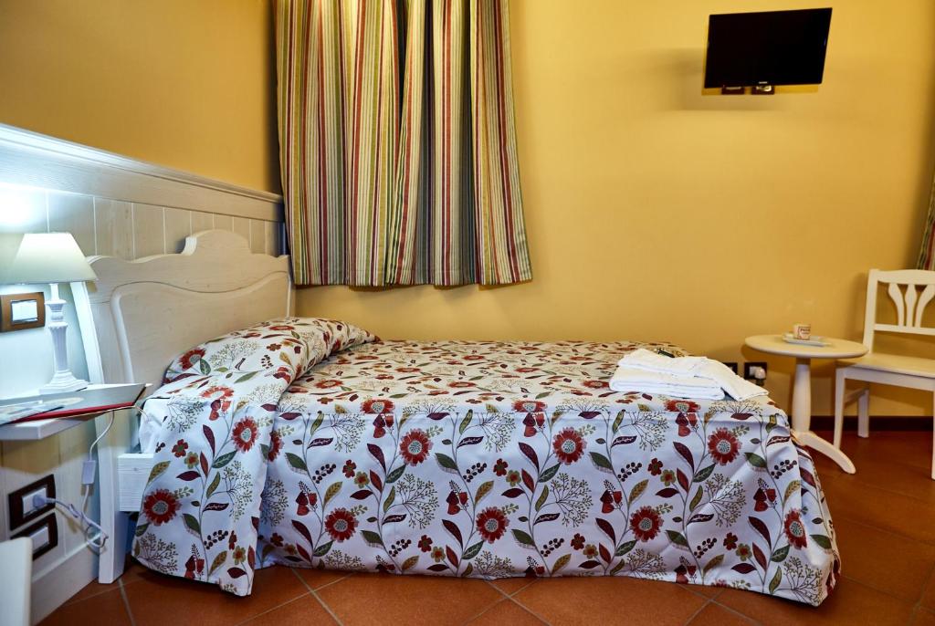 Łóżko lub łóżka w pokoju w obiekcie Albergo Trattoria Il Leone