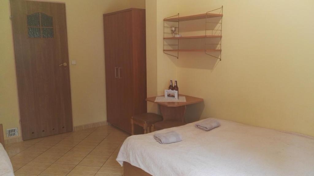Postel nebo postele na pokoji v ubytování Pensjonat Gorzowiak