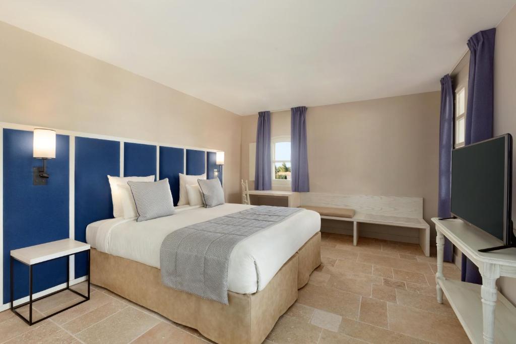 Postel nebo postele na pokoji v ubytování Le Fregate Provence
