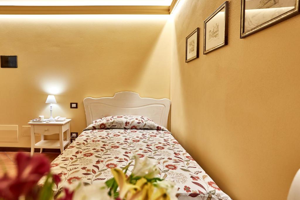 Łóżko lub łóżka w pokoju w obiekcie Albergo Trattoria Il Leone
