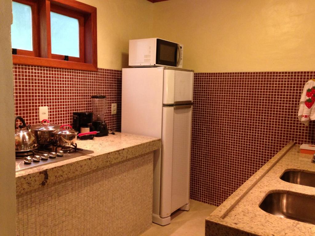 A cozinha ou kitchenette de Atmosphera Pousada