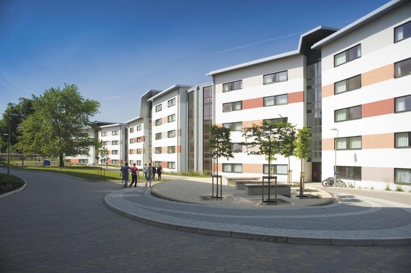 a group of people walking in front of a building at Venue Reading Accommodation in Reading