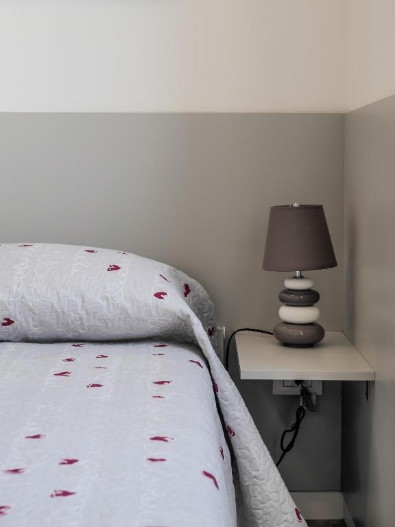 A bed or beds in a room at Le Case sul Parco