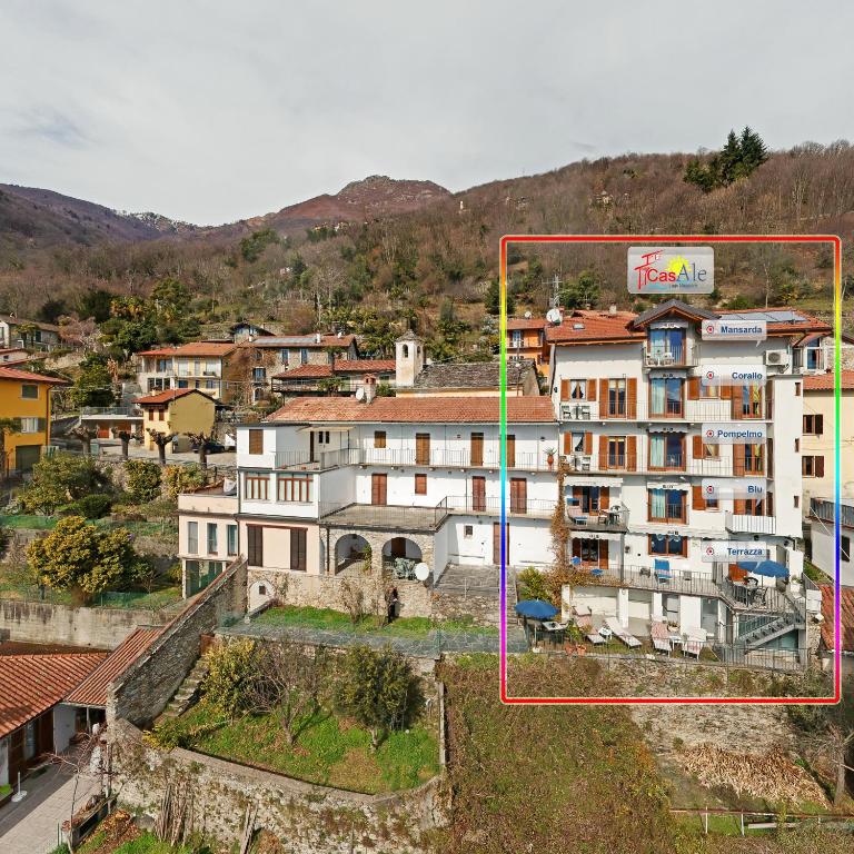 an aerial view of a building in a city at CasAle Fe-Wo - Appartamenti con vista Lago in Cannero Riviera