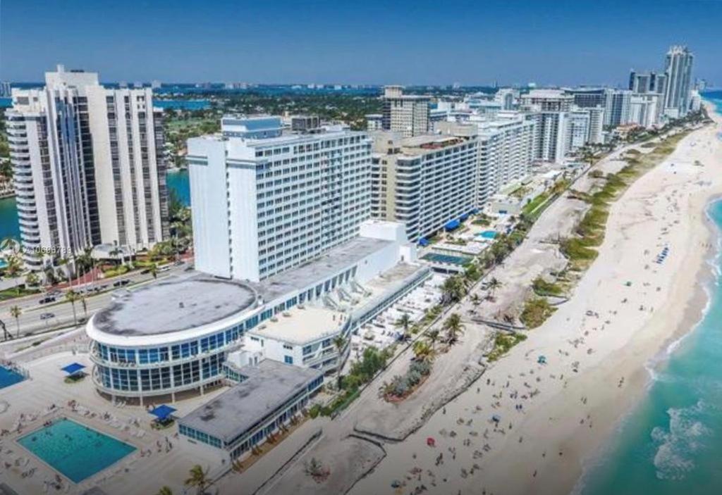 an aerial view of a beach and buildings at Castle Beach Club Apartments in Miami Beach