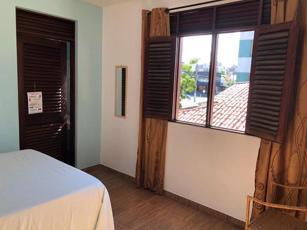 Postel nebo postele na pokoji v ubytování Slow Hostel - Hospedagem Criativa