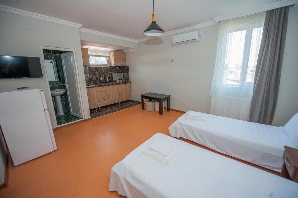 Postel nebo postele na pokoji v ubytování HOTEL COSMOS