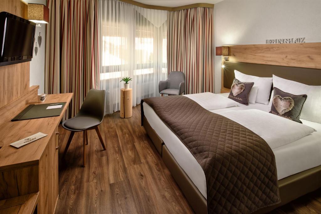 Katil atau katil-katil dalam bilik di Neo Hotel Linde Esslingen