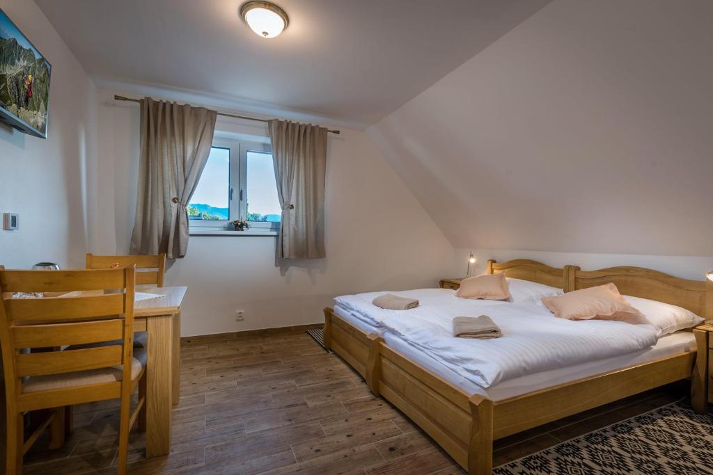Posteľ alebo postele v izbe v ubytovaní Na Verande apartments Jasna