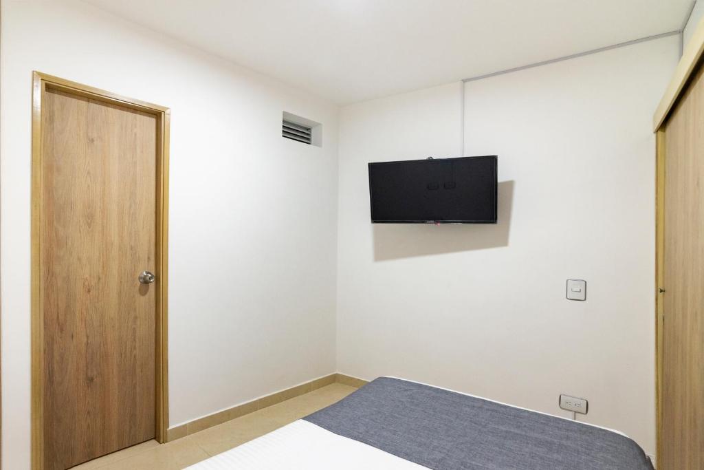 TV a/nebo společenská místnost v ubytování Ayenda Casa Megua