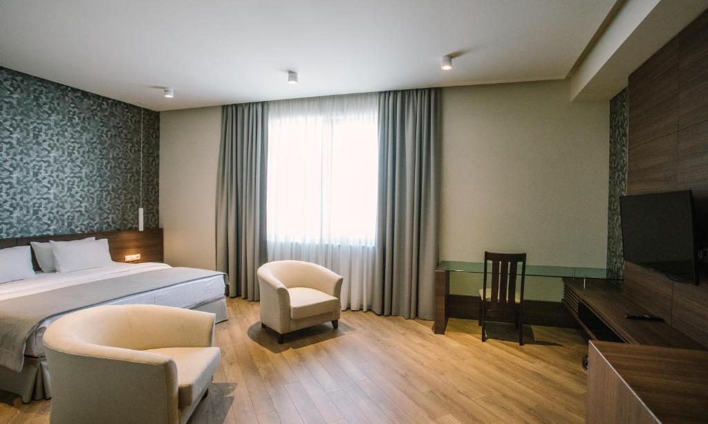 Postel nebo postele na pokoji v ubytování Hotel Tbilisi Tower