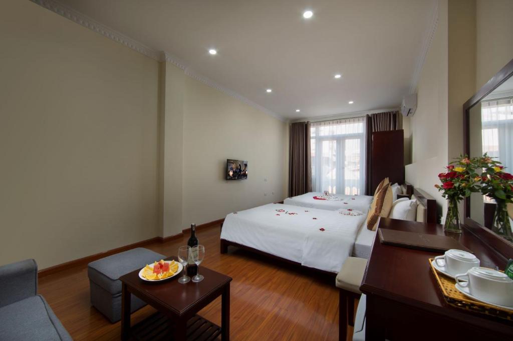 Postel nebo postele na pokoji v ubytování Spoon Hotel