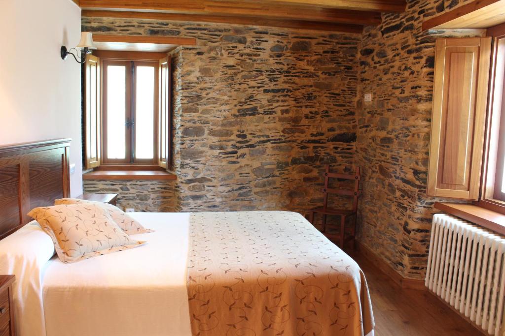 Postel nebo postele na pokoji v ubytování Casa Rural Soutomoro