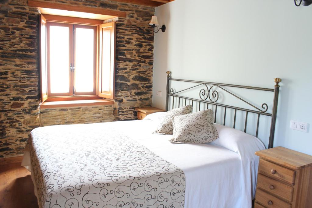 Postel nebo postele na pokoji v ubytování Casa Rural Soutomoro
