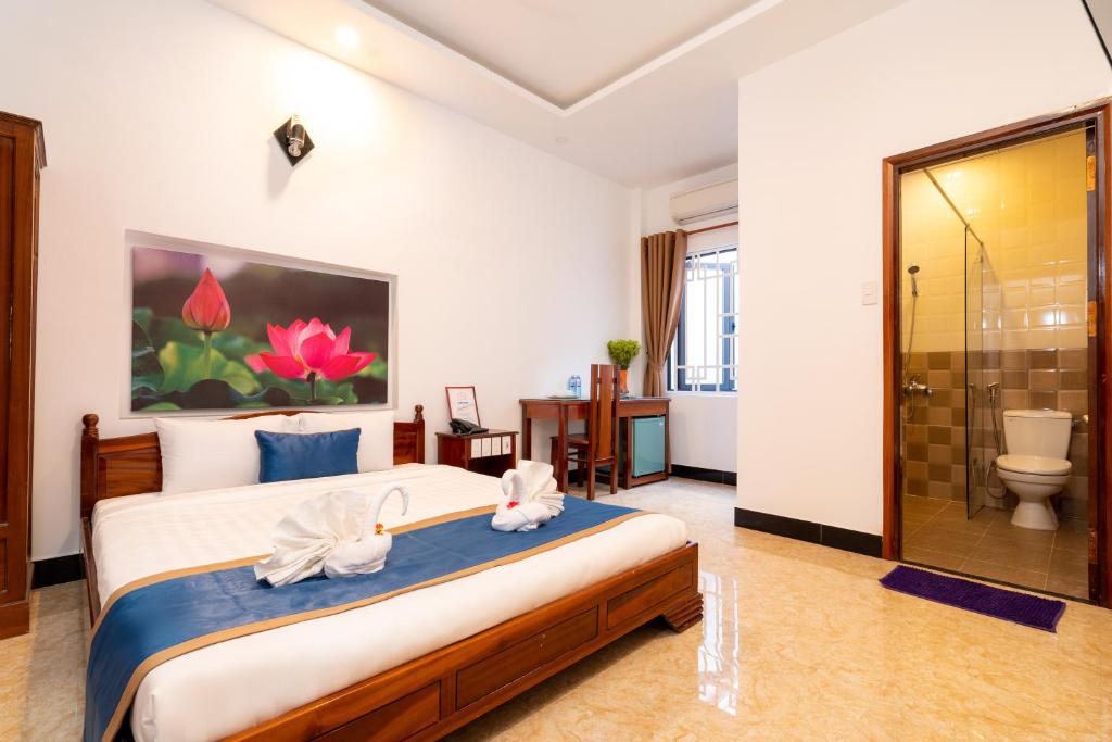 Postel nebo postele na pokoji v ubytování Family Hotel