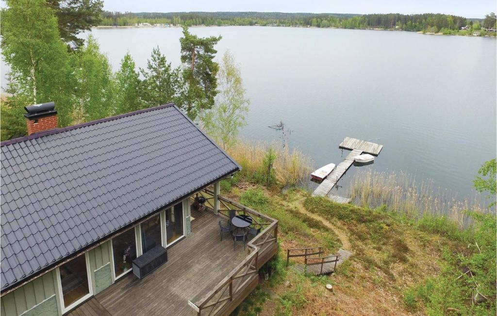 an aerial view of a house on a lake at Amazing Home In Forshaga With 2 Bedrooms in Forshaga