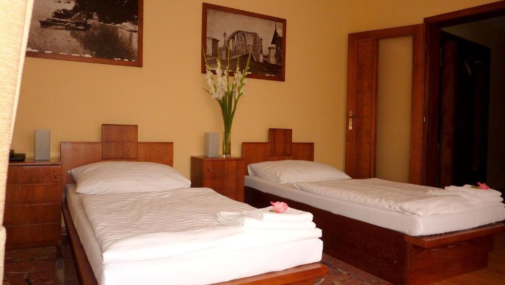 Postel nebo postele na pokoji v ubytování Hotel Banderium