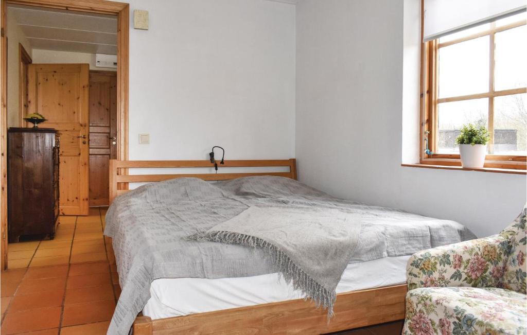 Postel nebo postele na pokoji v ubytování 0-Bedroom Holiday Home In Borrby