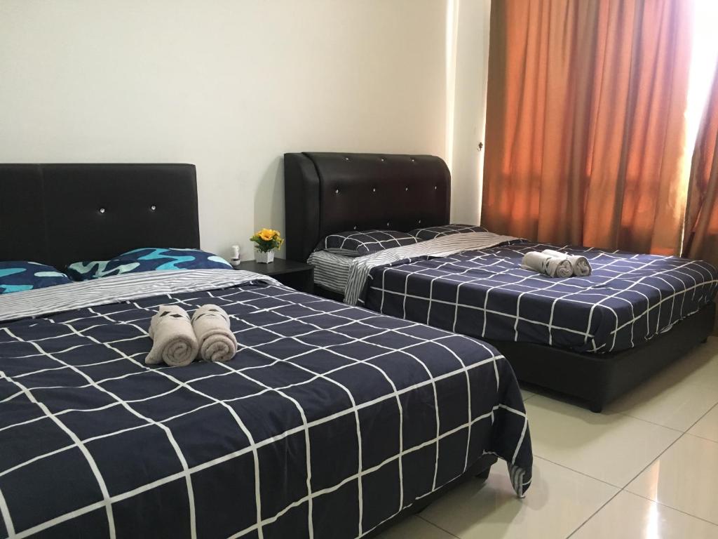 Postel nebo postele na pokoji v ubytování Woodsbury Suites 7722 Butterworth Penang