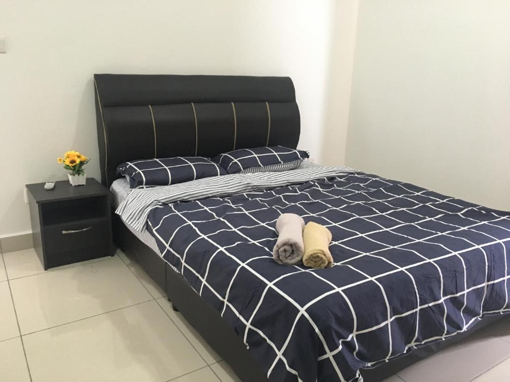 Postel nebo postele na pokoji v ubytování Woodsbury Suites 7722 Butterworth Penang