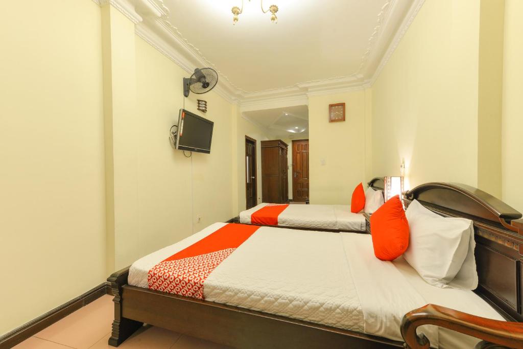 Postel nebo postele na pokoji v ubytování Lucky 2 Hotel & Travel