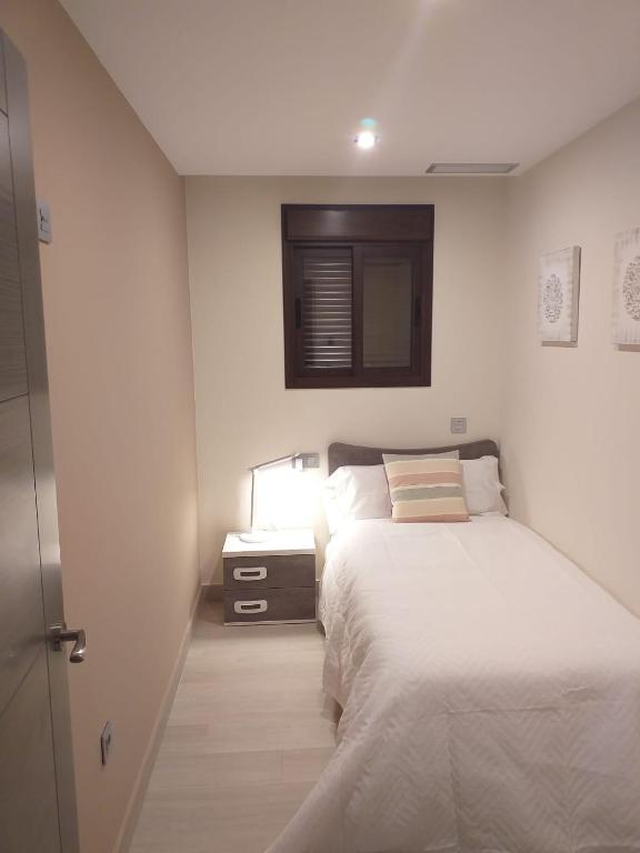 Posteľ alebo postele v izbe v ubytovaní Apartamentos Vacacionales Joctis, 2º A