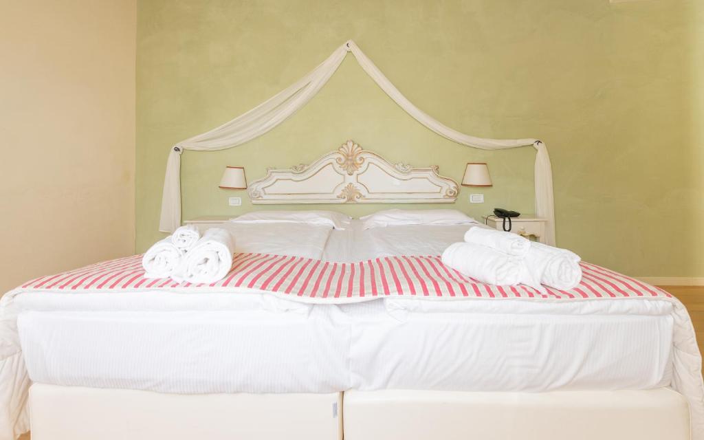 Postel nebo postele na pokoji v ubytování Hotel Villa Moron