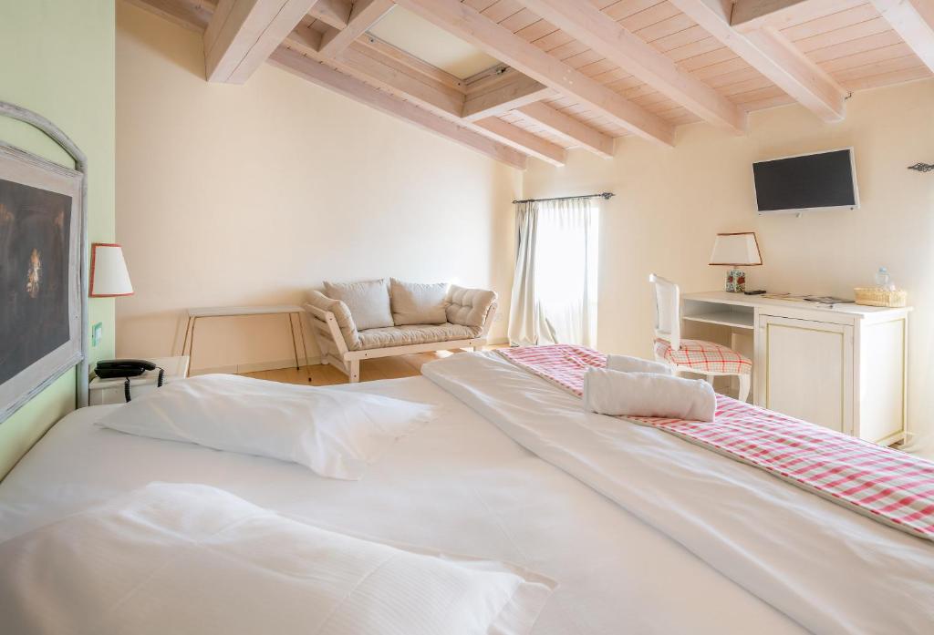 Postel nebo postele na pokoji v ubytování Hotel Villa Moron