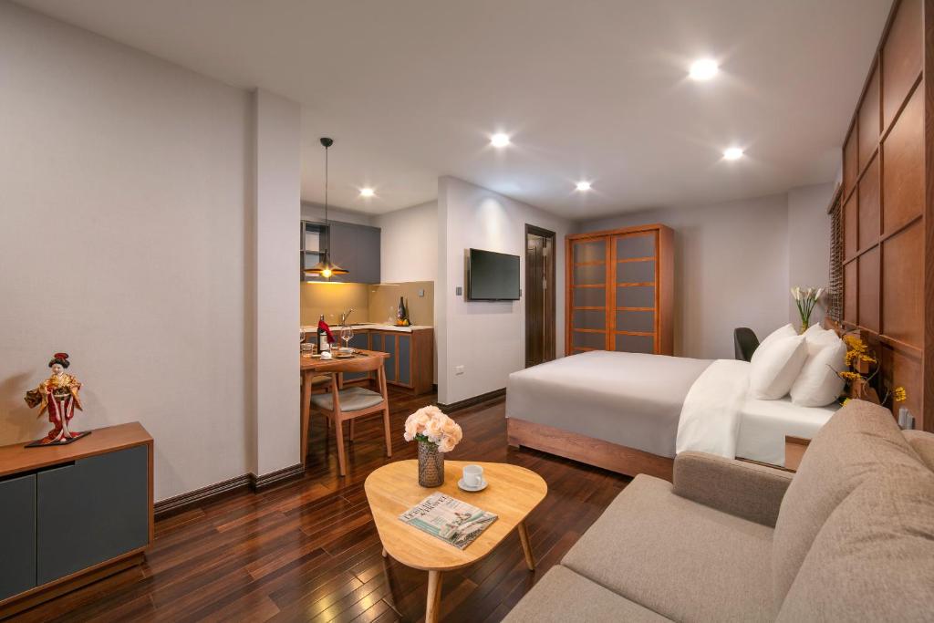 Postel nebo postele na pokoji v ubytování KEGON Hotel