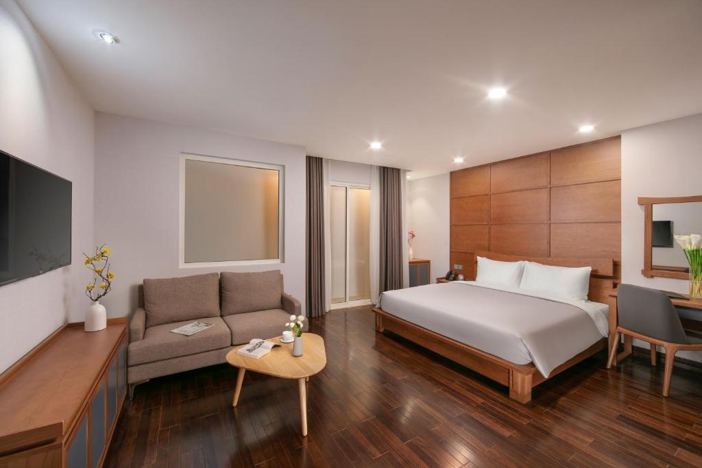 Postel nebo postele na pokoji v ubytování KEGON Hotel