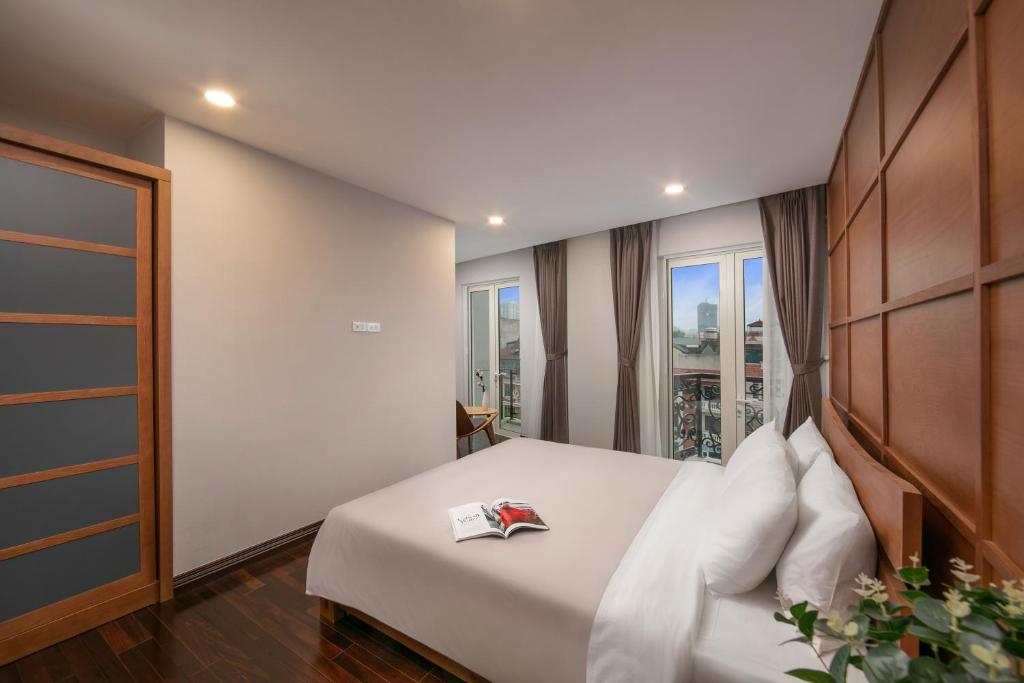 Postel nebo postele na pokoji v ubytování KEGON Hotel