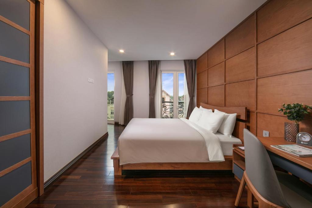 Postel nebo postele na pokoji v ubytování KEGON Hotel